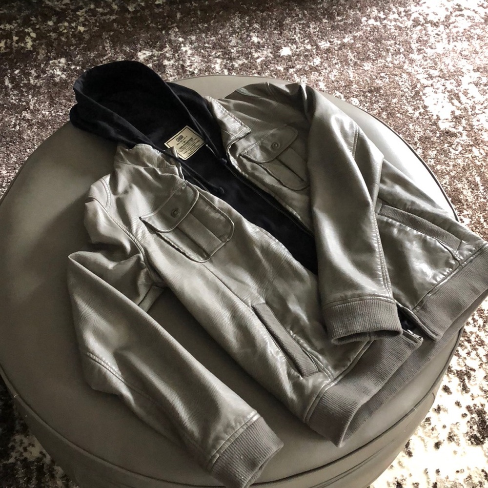Grey leather jacket with black hood.